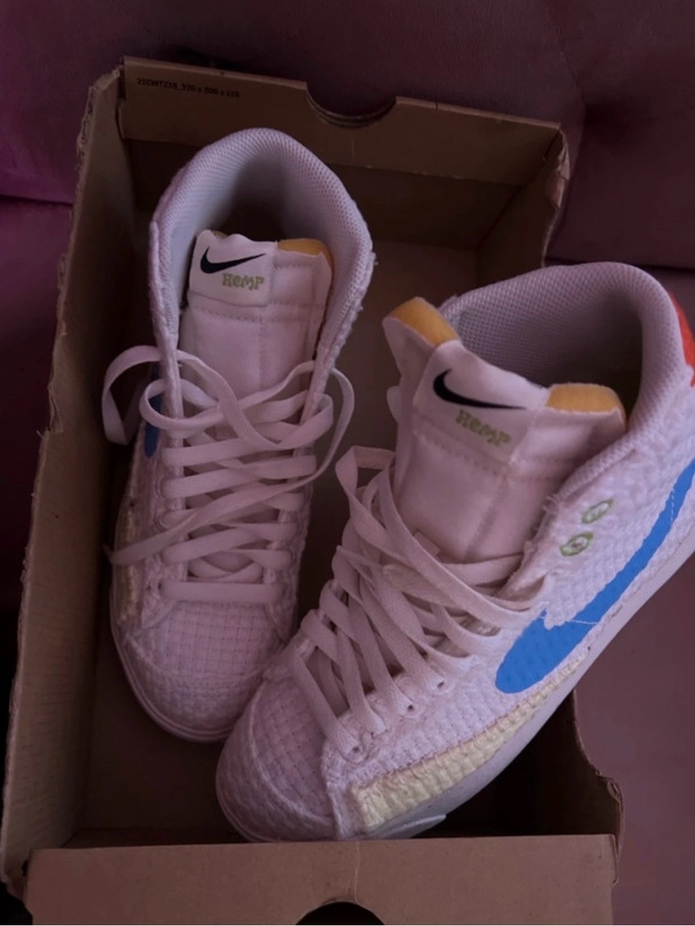 Nike Women’s White High-Top Sneakers with Blue Swoosh and Yellow Accents